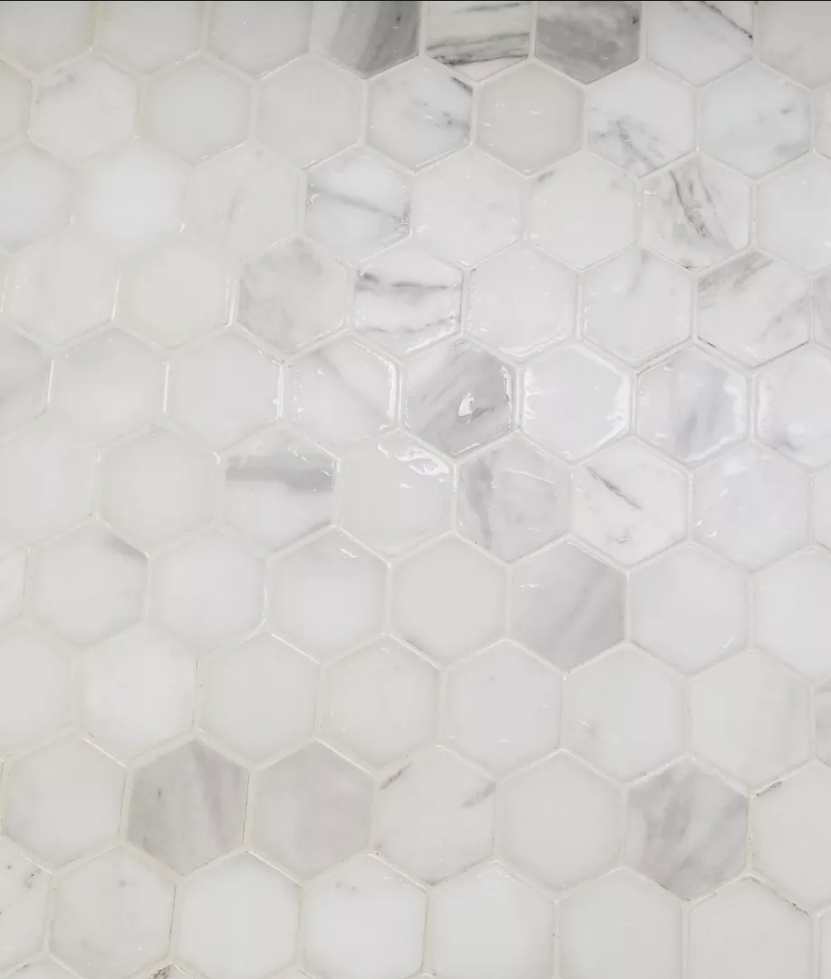 Same hexagon marble tile floor bright and polished after cleaning